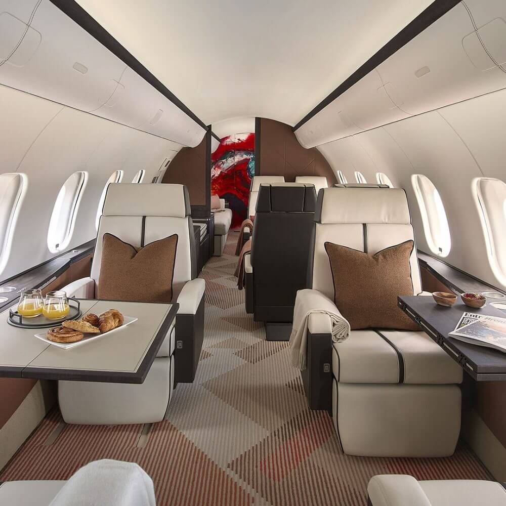 An artisan stitching fine leather for a private jet seat.
